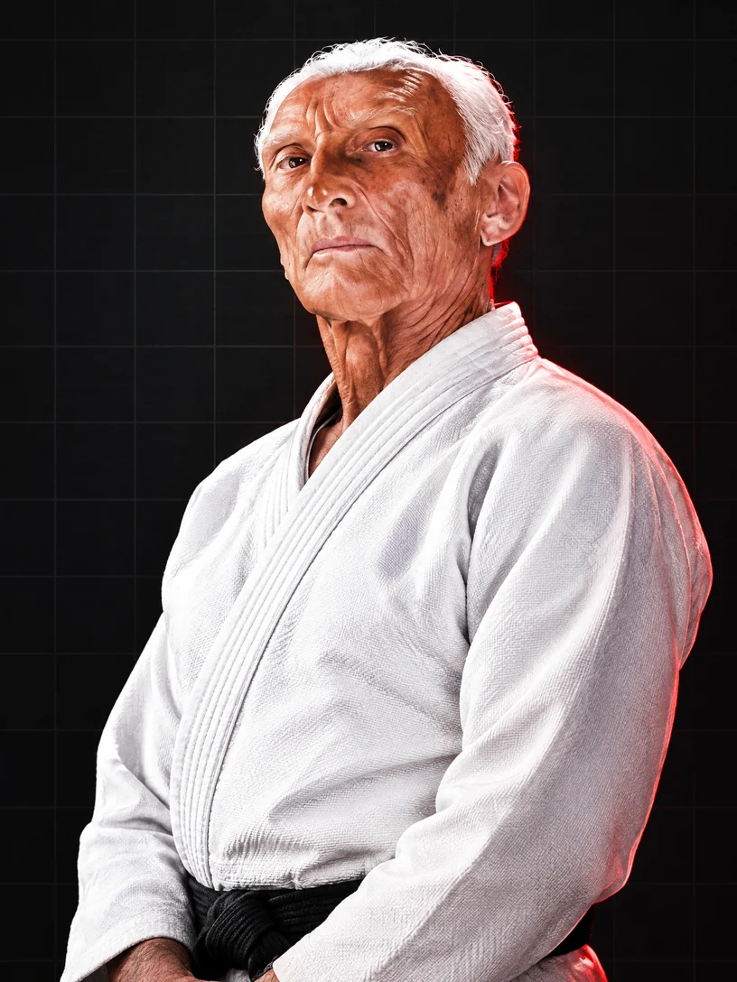 Editorial portrait of Helio Gracie in a white jiu-jitsu gi