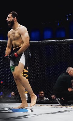 Adam Salameh standing inside an MMA cage