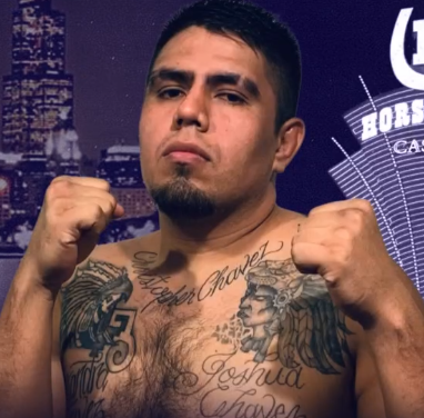 Hiram Chavez posing with raised fists