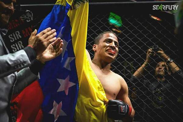 Yorkman Santana celebrating in an MMA cage
